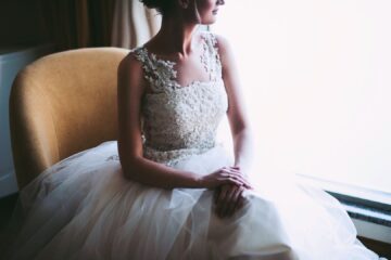 bride seated by window